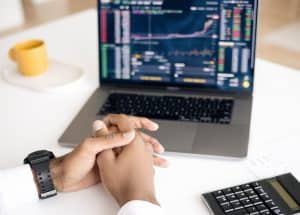 A person checking the markets, following Wealth Architects Septemper Quarter Update